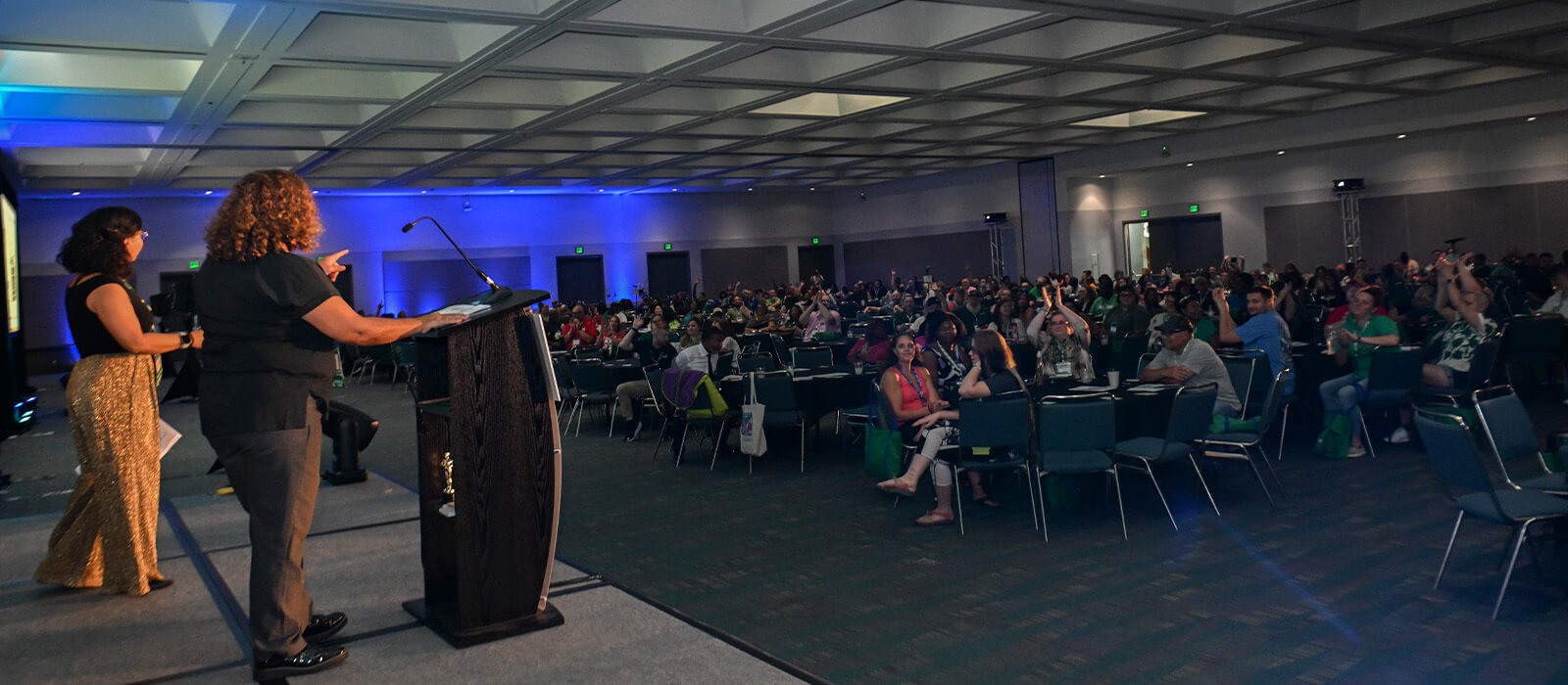 Speakers in front of an audience
